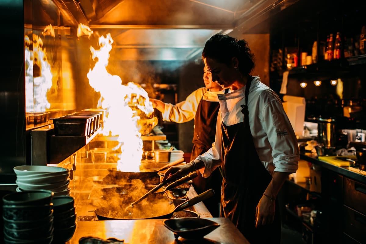 Chef plating food in a restaurant kitchen